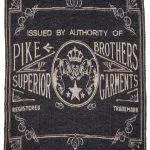 Vintage Pike Brothers wollen dekenpatroon uit 1969, met een vervaagd zwart logo.