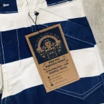 Poche avant, surpiqûres et étiquette cartonnée du pantalon Folsom Prison